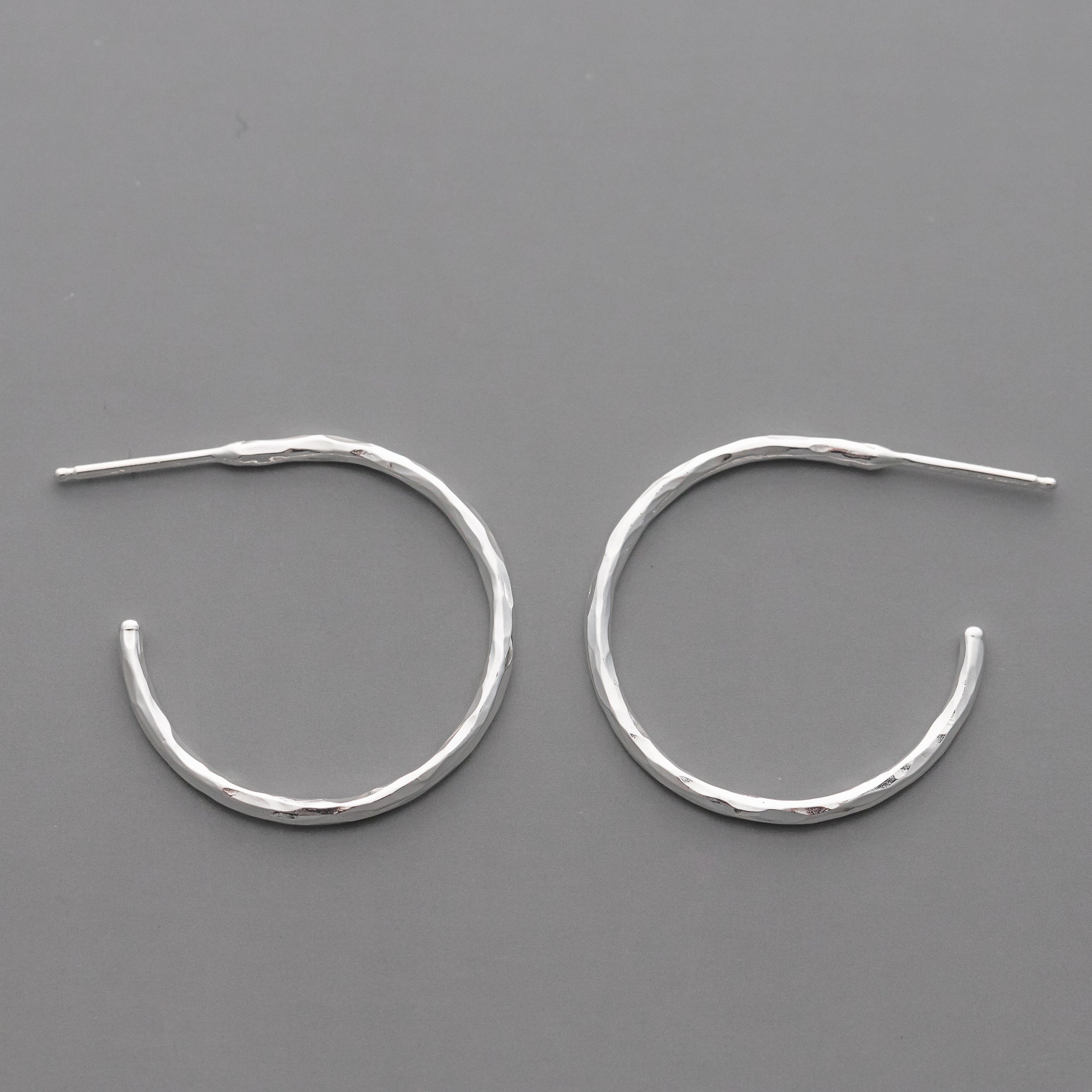 These handmade sterling silver hoop earrings feature an artisan hand hammered texture and beautiful high shine finish.  Handmade Argentium Sterling Silver jewelry