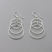 Handmade Sterling Silver Dangle Earrings with layered circles and hand hammered texture.  Polished to a high shine these artisan crafted earrings are nickel free and made with argentium silver.