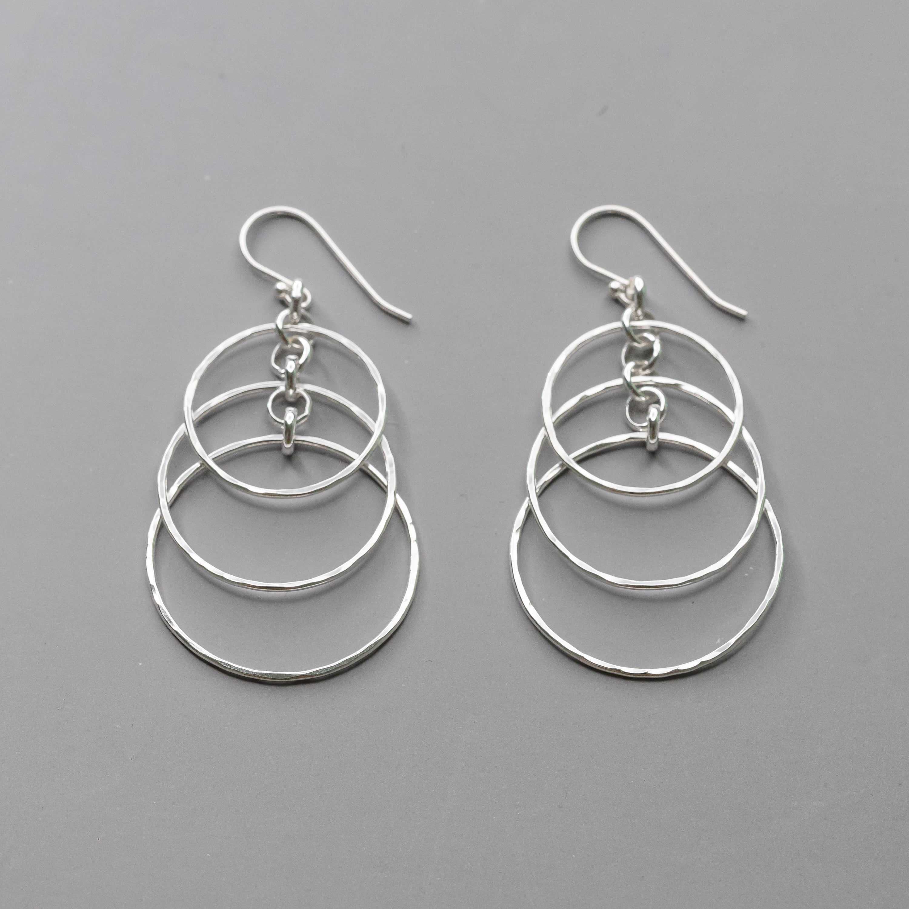 Handmade Sterling Silver Dangle Earrings with layered circles and hand hammered texture.  Polished to a high shine these artisan crafted earrings are nickel free and made with argentium silver.