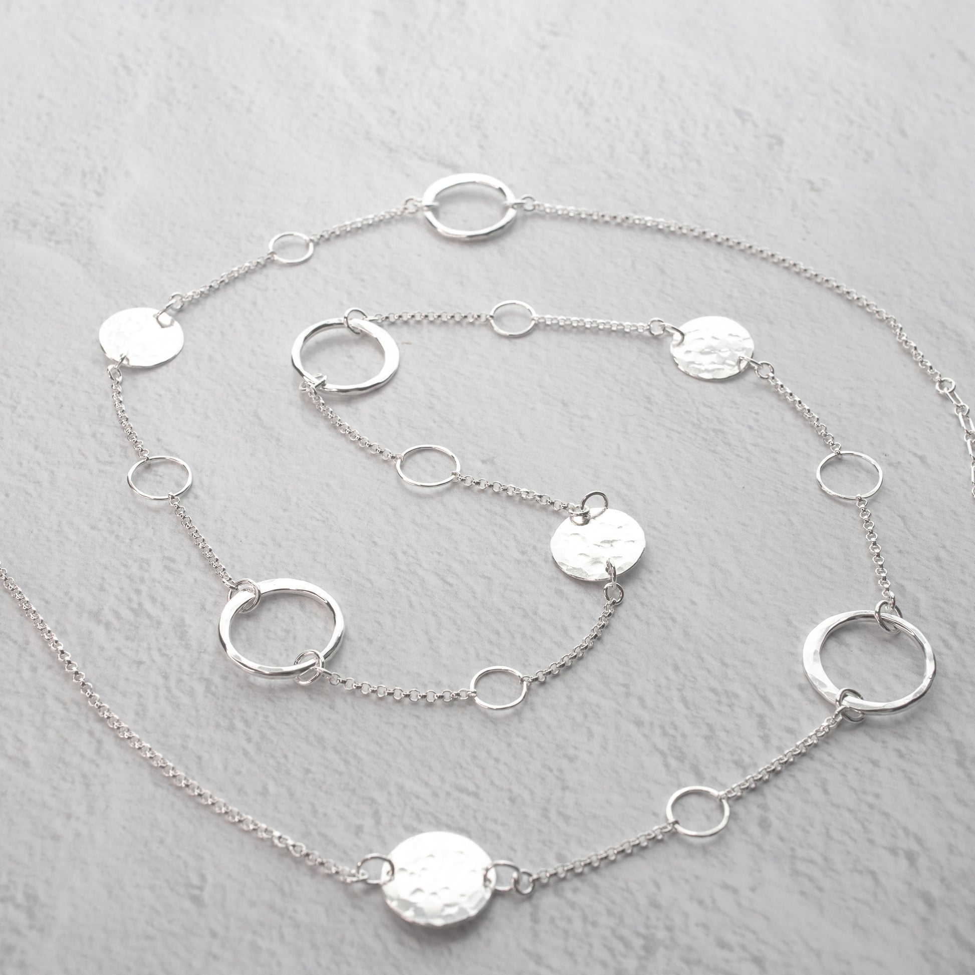 Handmade sterling silver Long station necklace with hand hammered details and forged artisan circle elements.  Unique handcrafted jewelry