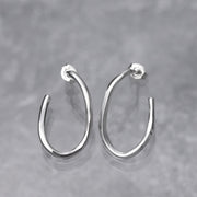 Handmade sterling silver hoop earrings are hand hammered for dimension and polished to a high shine.  Nickel free and artisan crafted, these Argentium Silver Hoops have post ear wires.