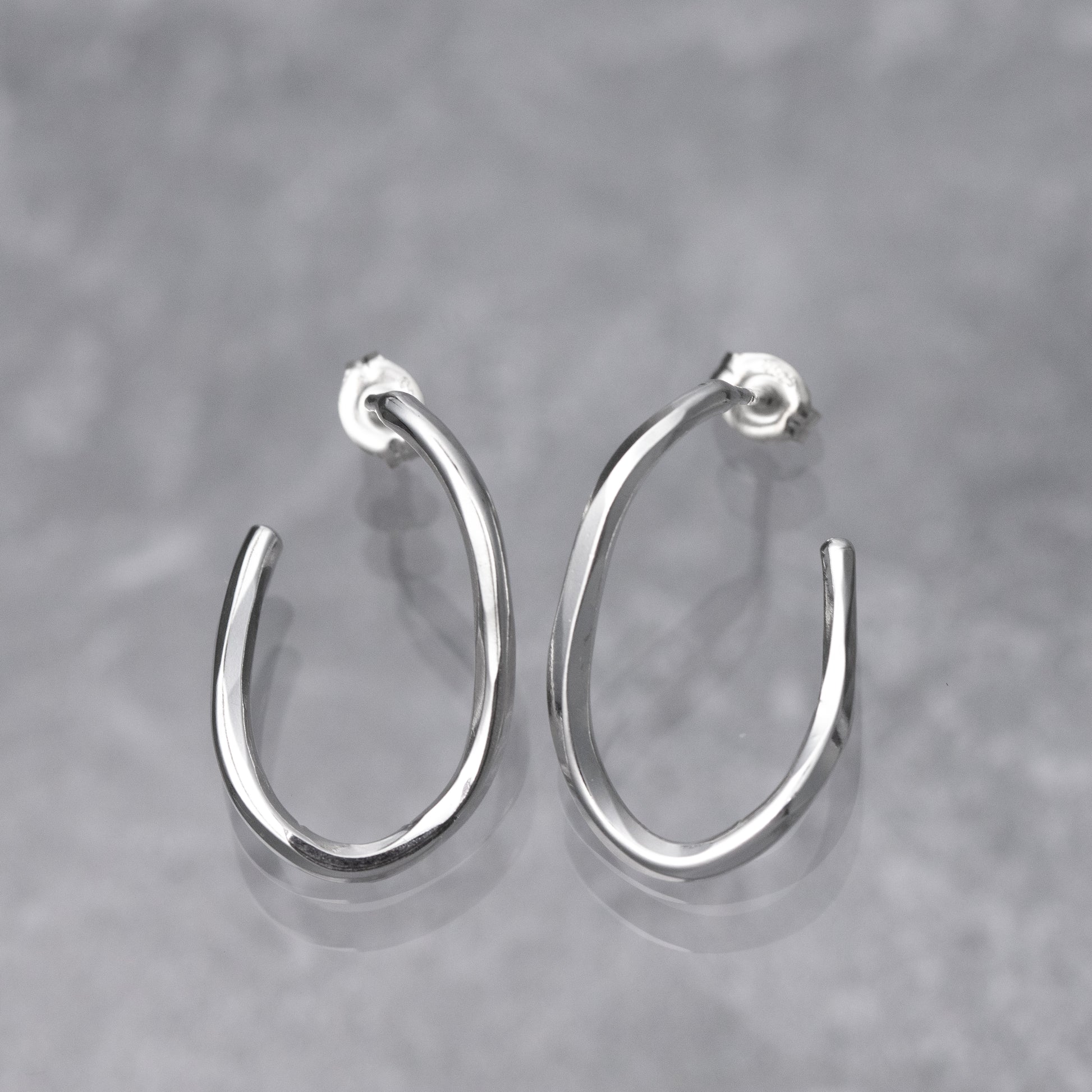 Handmade sterling silver hoop earrings are hand hammered for dimension and polished to a high shine.  Nickel free and artisan crafted, these Argentium Silver Hoops have post ear wires.