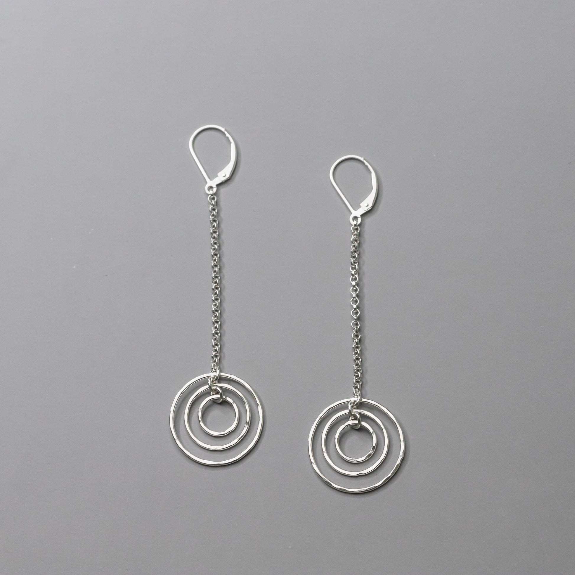 Long Silver Earrings handmade with solid sterling silver.  Nickel free leverback statement earrings with hammered circles.  Handmade artisan silver jewelry