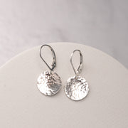 handmade sterling silver disc earrings are artisan hammer textured and dangle from nickel free sterling silver leverback ear wires for a secure fit.  Handcrafted silver dangle earrings made with Argentium Sterling Silver