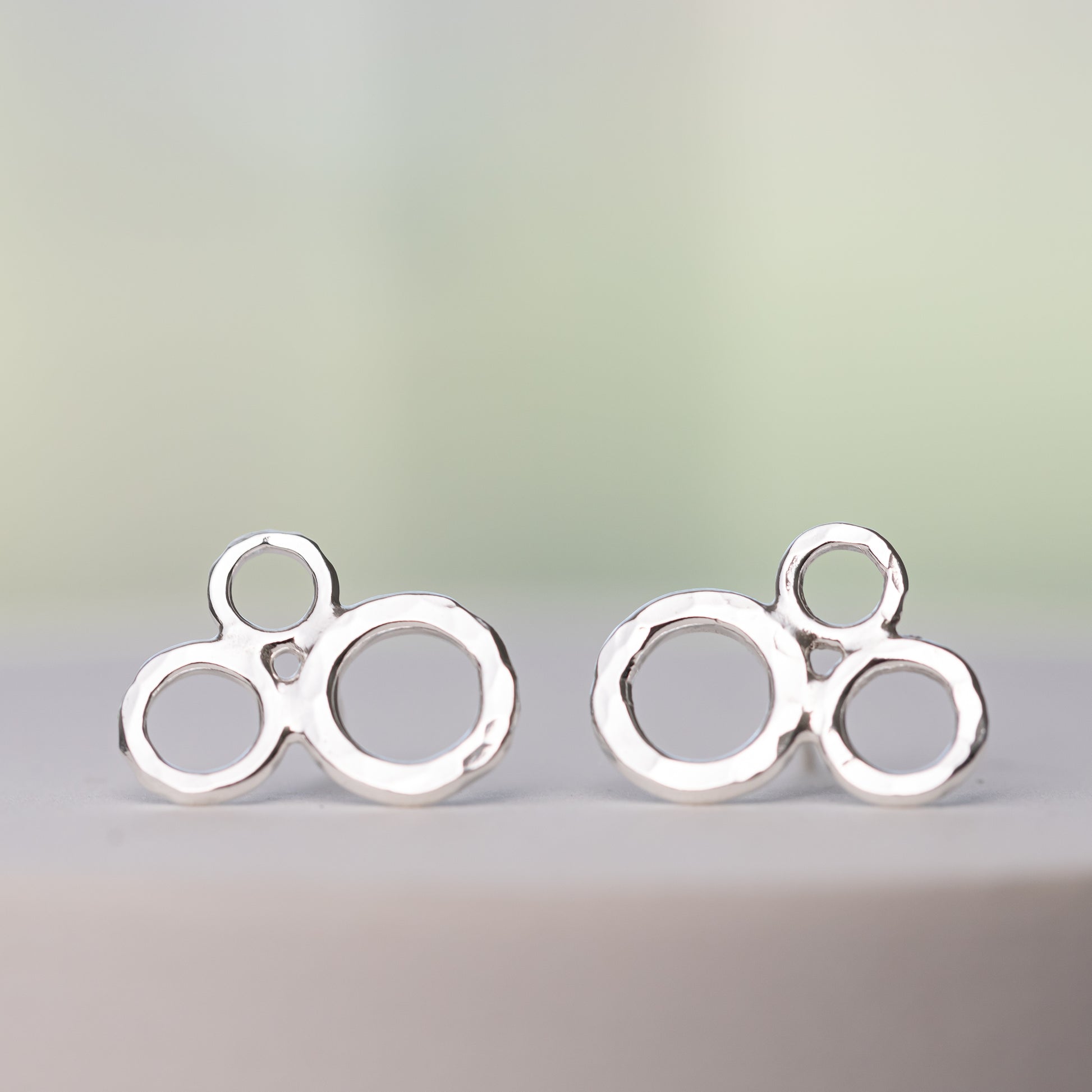 handmade nickel free sterling silver earrings in a cute bubble stud design.  Three circles are clustered together with artisan hammered details.  Handcrafted Argentium Sterling Silver Jewelry